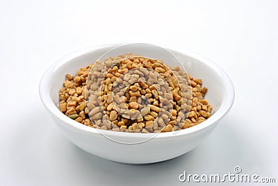 Some organic fenugreek seeds Stock Photo