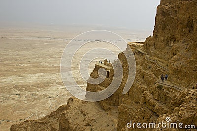 Some of the reconstructed ruins of the ancient Jewish clifftop fortress of Masada in Southern Israel. Everything below the marked Editorial Stock Photo