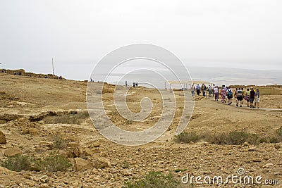 Some of the reconstructed ruins of the ancient Jewish clifftop fortress of Masada in Southern Israel. Everything below the marked Editorial Stock Photo