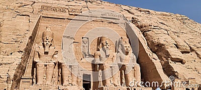 Stone carvings of pharaohs adorning the majestic wall Editorial Stock Photo