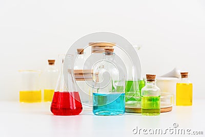 some test tube on the white table with beakers, flasks, and test tubes filled with colorful liquids Stock Photo