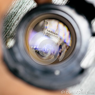 Some tiny screws seen on a loupe lens from an unmade camera lens close up still Stock Photo