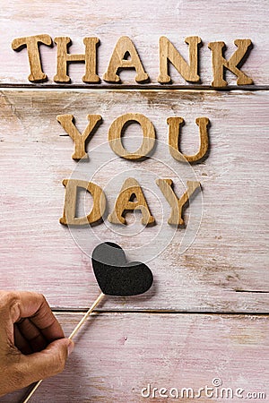 Wooden letters forming the text thank you day Stock Photo