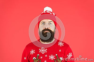 Someone stole christmas. upset because santa delay. has no present. serious hipster red background. bearded man knitted Stock Photo