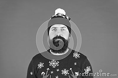 Someone stole christmas. upset because santa delay. has no present. serious hipster red background. bearded man knitted Stock Photo