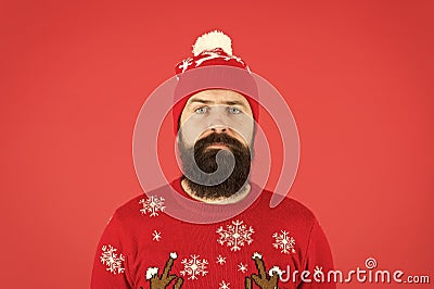 Someone stole christmas. upset because santa delay. has no present. serious hipster red background. bearded man knitted Stock Photo