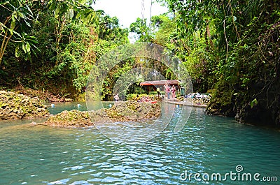 Somerset Falls - a waterfall and blue lagoon in Port Antonio, Jamaica Editorial Stock Photo