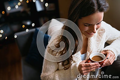 Sometimes downtime is just whats needed. an attractive young woman relaxing on the sofa with a cup of coffee at home. Stock Photo