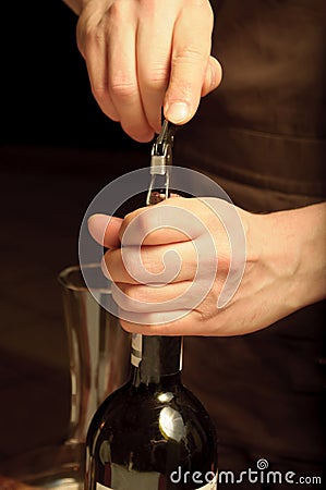 A sommelier opening wine bottle Stock Photo