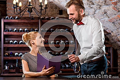 Sommelier with young woman on degustation in the Stock Photo