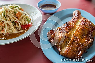 Somtum with chicken grilled Stock Photo