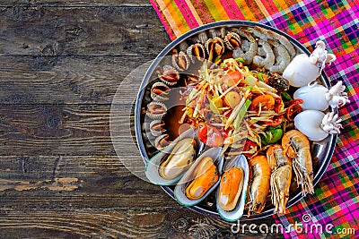 Somtum Seafood, with shrimp shells, placed in a tray, beautifully placed on a wooden Stock Photo