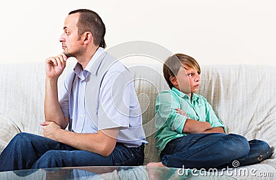 Son and dad having domestic quarrel Stock Photo