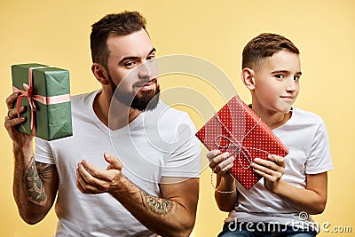 Son and father gives gift to each other. Fathers day, family holiday, vacation Stock Photo