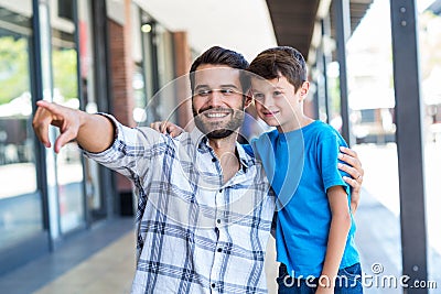 Son and father look away Stock Photo