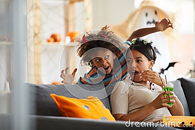 Son having jump scare while frightening mother Stock Photo