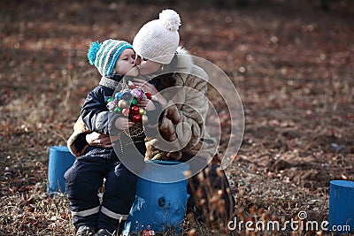 Son kissing mom for gifts Stock Photo