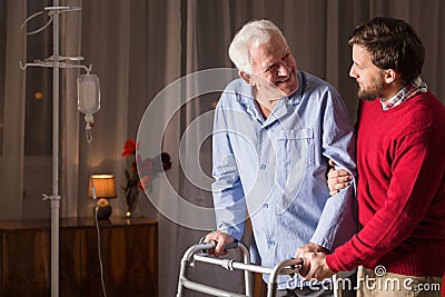 Son supporting disabled father Stock Photo