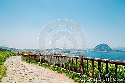 Songaksan Mountain trail with sea and Sanbangsan Mountain in Jeju Island, Korea Stock Photo