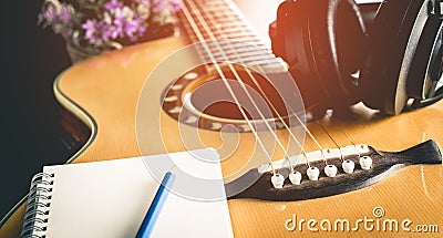 Songwriting equipment, guitar and headphone Stock Photo