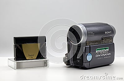 Sony Handycam DCR-HC90E with Mini DV cassette. Vintage Technology isolated on white Editorial Stock Photo