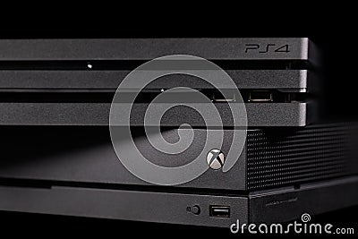 Sony`s Playstation 4 Pro and Microsoft`s XBOX One X Editorial Stock Photo