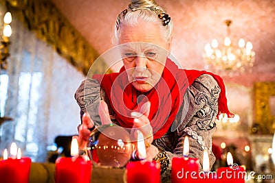 Soothsayer during esoteric session with Crystal ball Stock Photo