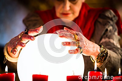 Soothsayer during a Seance or session with Crystal ball Stock Photo