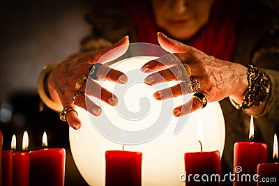 Soothsayer during a Seance or session with Crystal ball Stock Photo