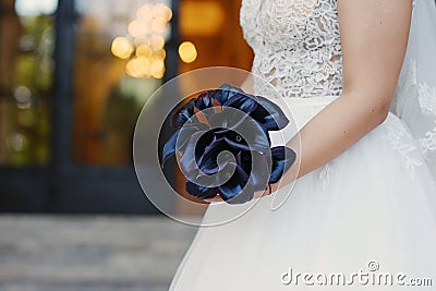 Sophisticated dark plum calla lilies bridal bouquet, the perfect accessory for a regal and mysterious effect Stock Photo