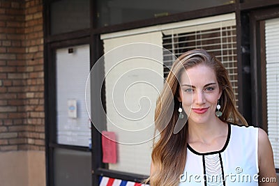 Sophisticated elegant lady in white dress with arrogant expression Stock Photo