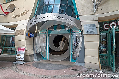 Entrance to Krzywy Domek crooked house Editorial Stock Photo