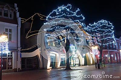 Crooked little house Polish: Krzywy Domek at winter time at night Editorial Stock Photo