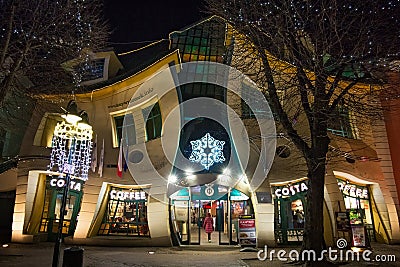 SOPOT, POLAND - DECEMBER 20, 2017: Night view of the famous Crooked House building Krzywy Domek in polish on the Monte Cassino Editorial Stock Photo