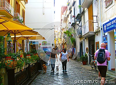 SORRENTO,ITALY - SEPTEMBER, 2012: Atmosphere of streets of Sorrento. Architecture of old colorful houses, cafes, souvenirs. shops Editorial Stock Photo