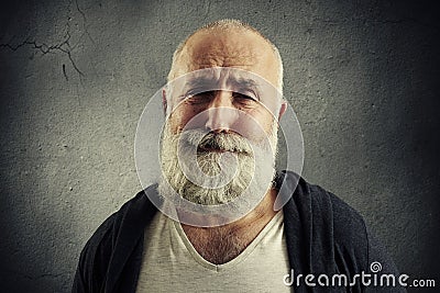 Sorrowful senior man with grey-haired beard Stock Photo