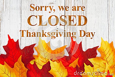 Closed Thanksgiving Day message with autumn leaves Stock Photo