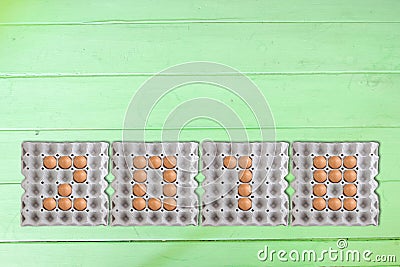 Sort eggs as the 2016 years in the paper tray Stock Photo