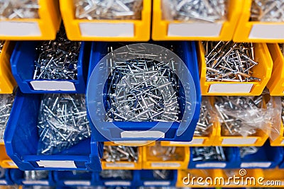 Sorted rivet in boxes in the store Stock Photo