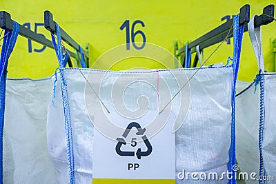 Sorting recyclables. The sorted polypropylene PP plastic, is placed in a container with the appropriate marking Stock Photo