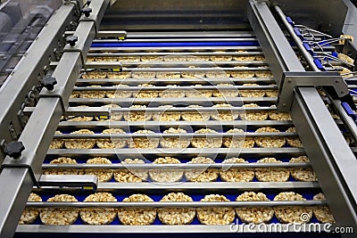 Sorting of round dietary loaves on conveyor automated machine Stock Photo