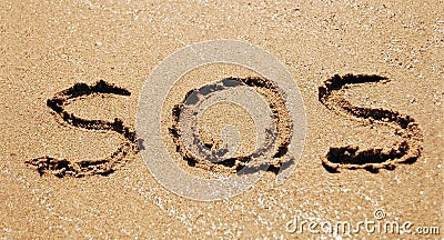 Sos in sand Stock Photo