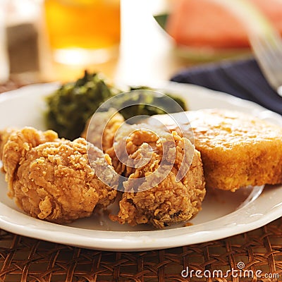 Soul food - fried chicken with collard greens and corn bread Stock Photo