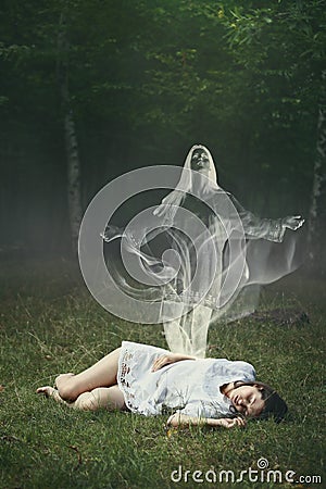 Soul of a sleeping woman in the forest Stock Photo