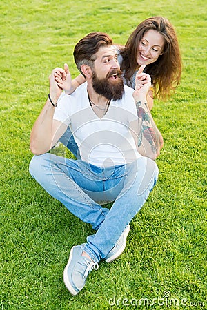 Soulmates closest people. Simple happiness. Couple in love relaxing on green lawn. Playful girlfriend and boyfriend Stock Photo