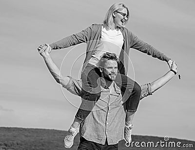 Soulmates enjoy freedom together. Couple happy date having fun together. Freedom concept. Man carries girlfriend on Stock Photo