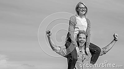 Soulmates enjoy freedom together. Couple in love enjoy freedom outdoor sunny day. Man carries girlfriend on shoulders Stock Photo