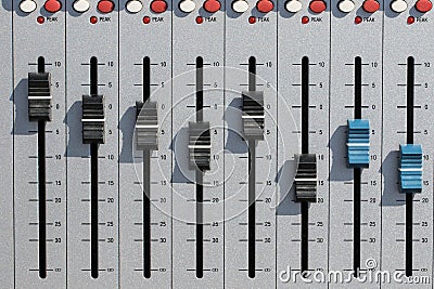 Sound mixing desk faders. Music studio recording equipment volume close-up Stock Photo