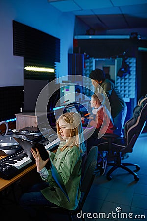 Sound producer with children band Stock Photo
