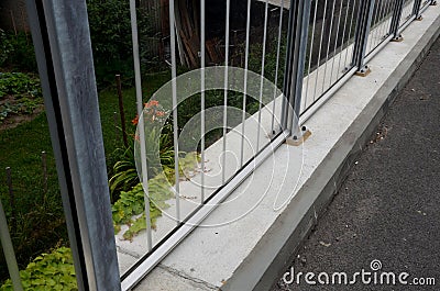 Soundproof wall of blue glass on a highway bridge embedded in metal beams, on the street. road traffic noise is reduced. safety pr Stock Photo